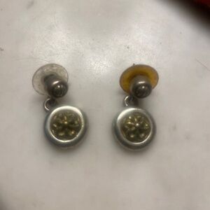 Great silver earring with gold imprint.